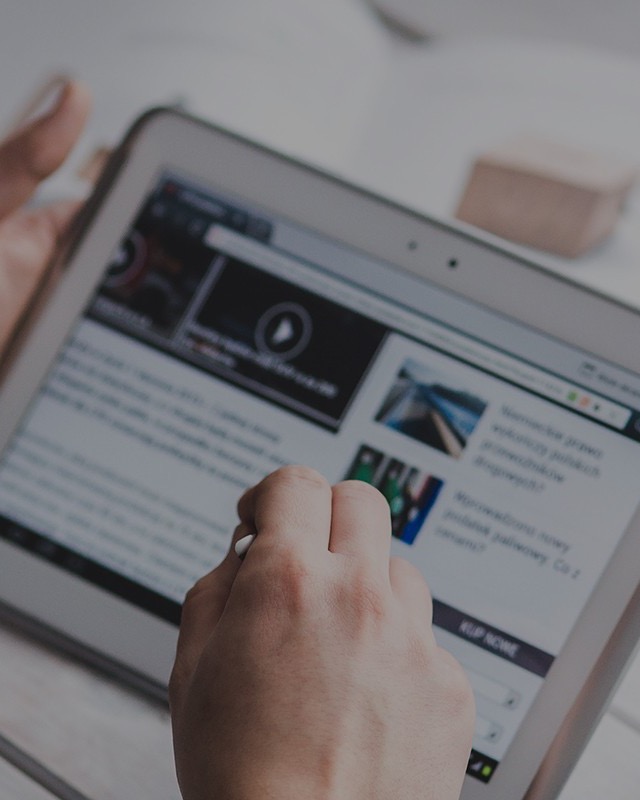 A distributor reviewing business resources on a tablet.